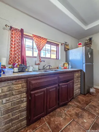 a room with a dresser and a window