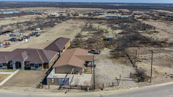 an aerial view of houses with a outdoor space