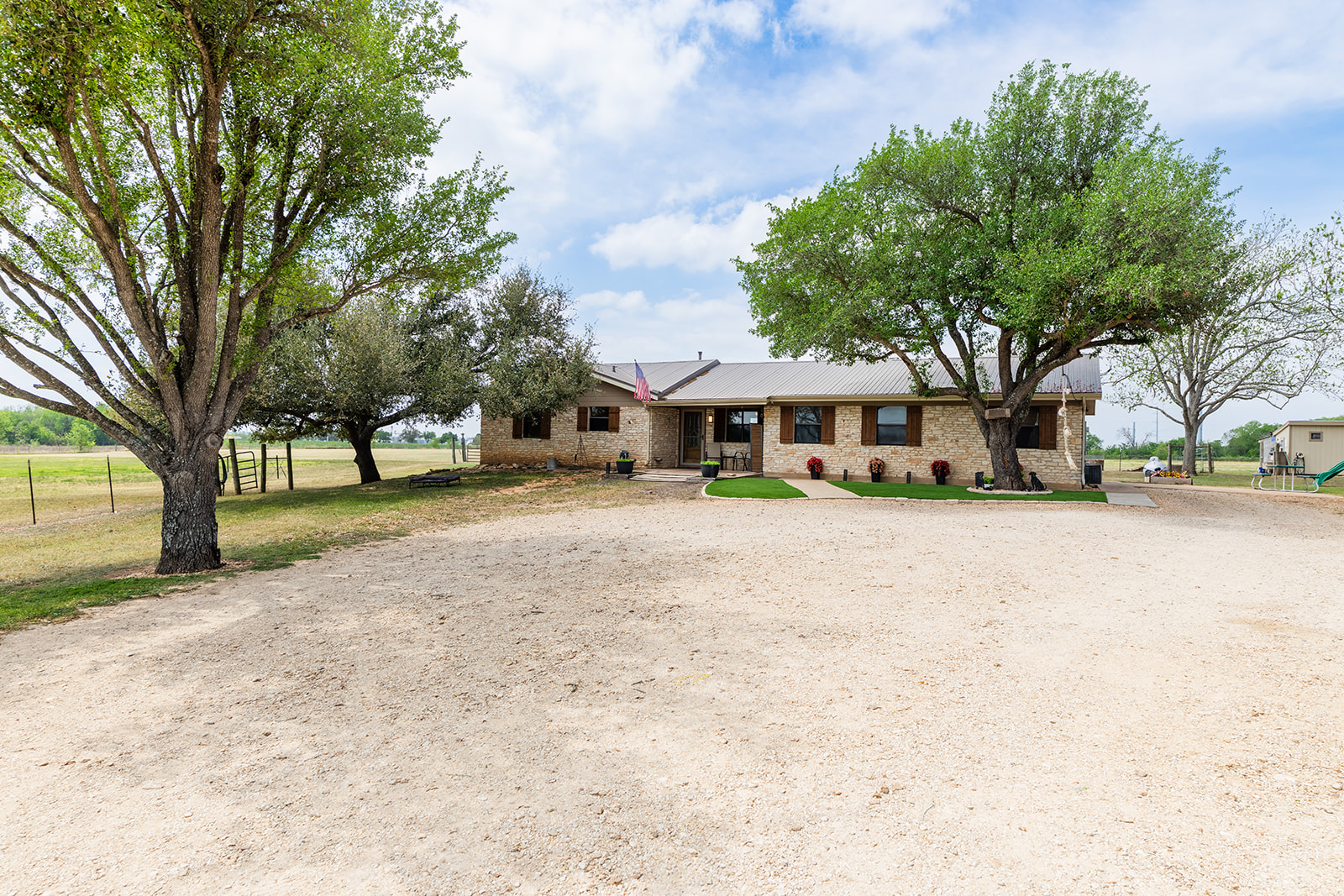 1001 Gravel Pit Road Taylor, TX 76574 - Photo 3 of 40 a front view of a house with a yard and trees