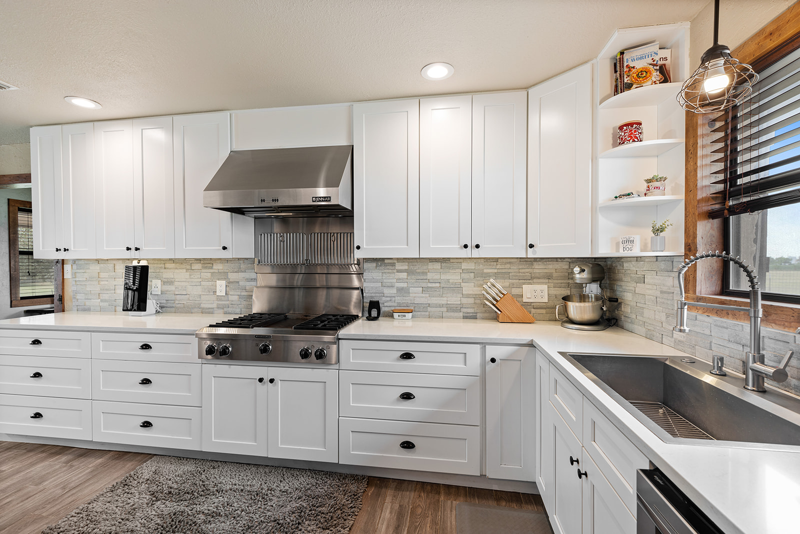 1001 Gravel Pit Road Taylor, TX 76574 - Photo 9 of 40 a kitchen with cabinets appliances a sink and a counter top space