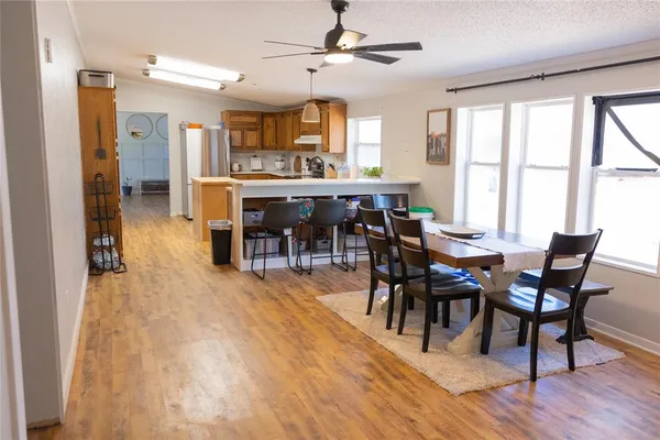 a dining room with furniture and window