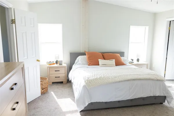 a bathroom with a tub sink and a mirror