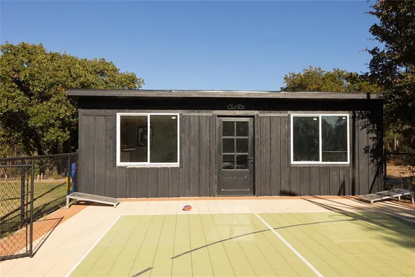 a house with trees in the background