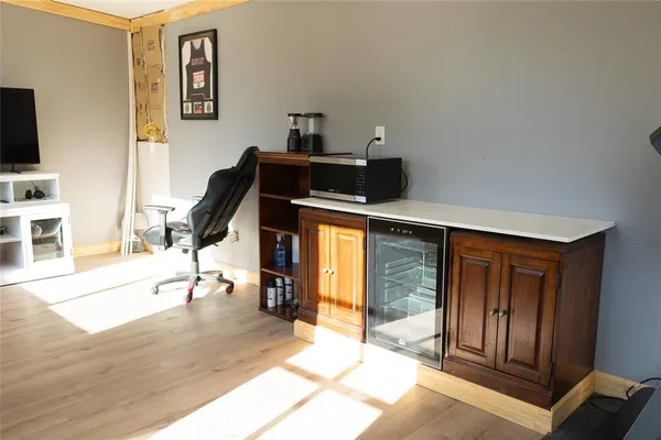 a view of a livingroom with furniture and a flat screen tv