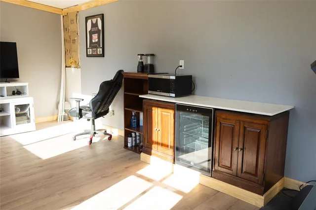 a view of a livingroom with furniture and a flat screen tv