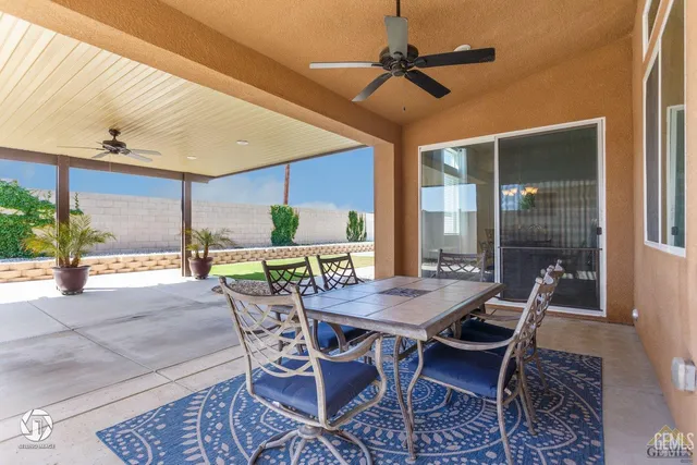 a view of an outside dining space with furniture