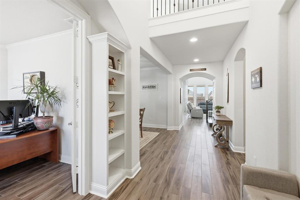 6371 Whiskerbrush Road Flower Mound, TX 76226 - Photo 8 of 38 Built in shelving through foyer.