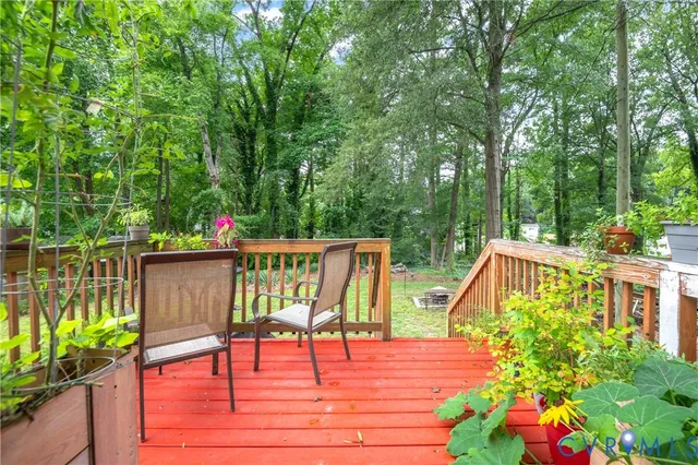 a view of a wooden deck with chairs