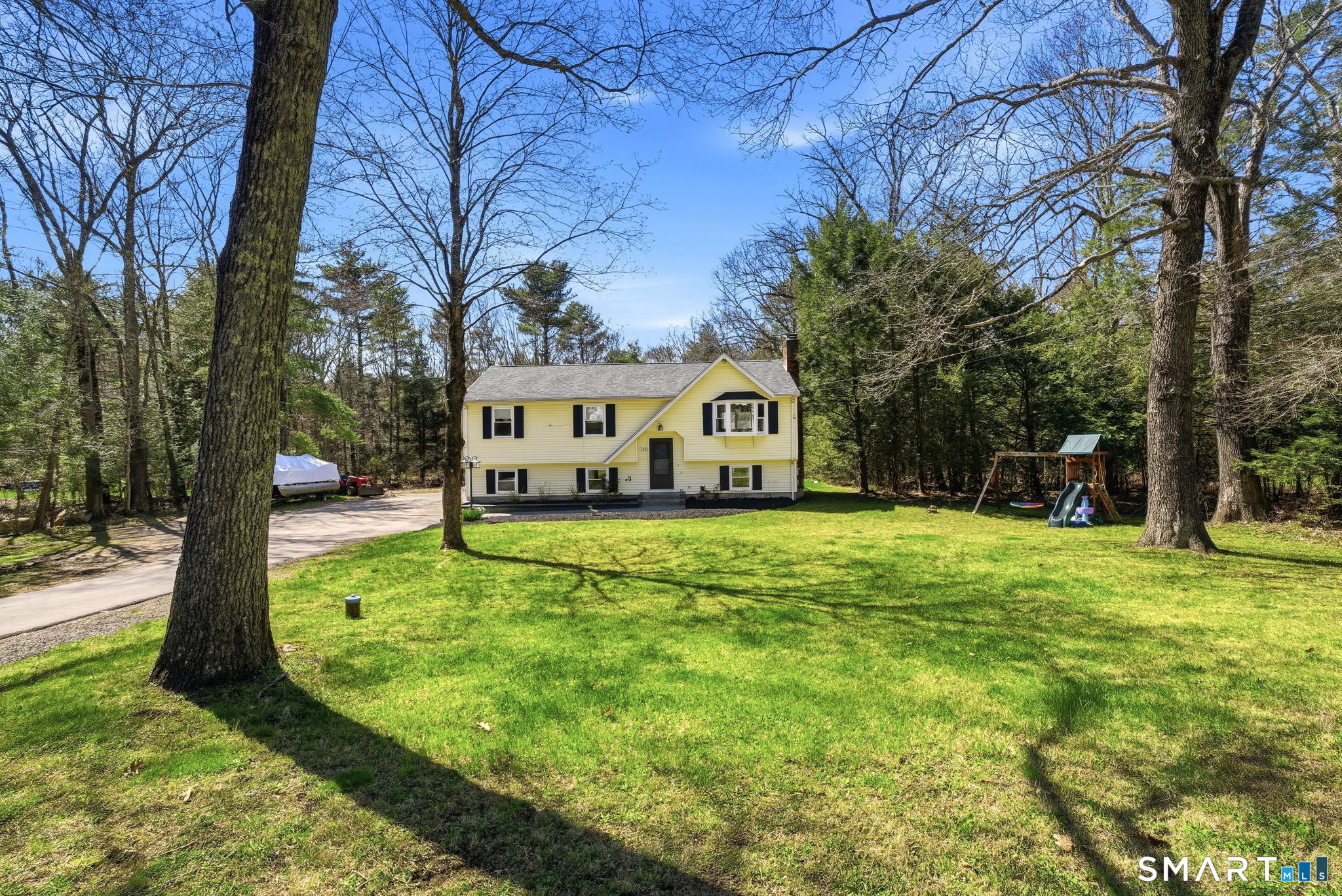 264 Quaddick Town Farm Road Thompson, CT 06277 - Photo 2 of 35 a view of house with backyard and tree