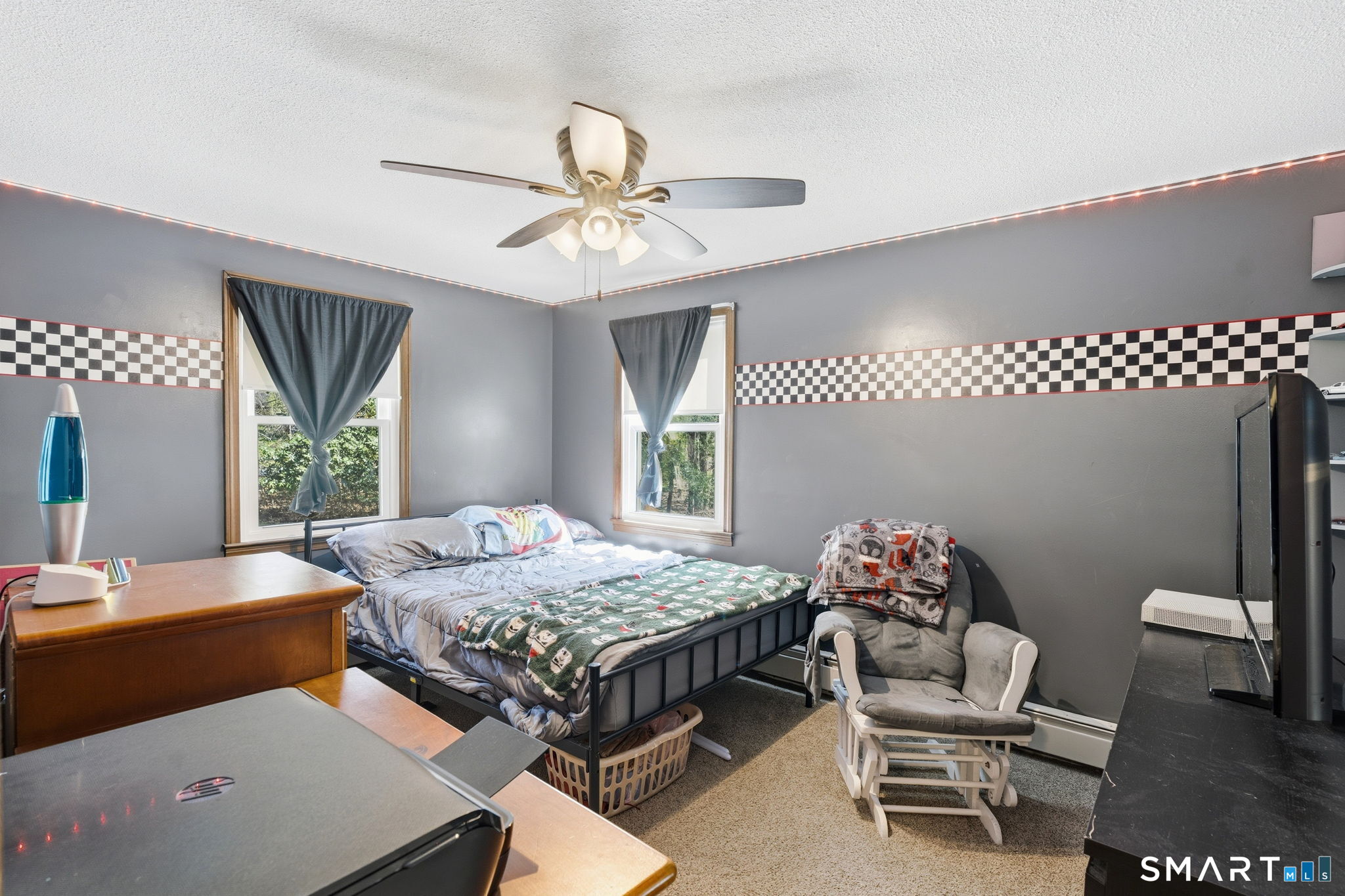 264 Quaddick Town Farm Road Thompson, CT 06277 - Photo 21 of 35 a bedroom with a bed and a chandelier