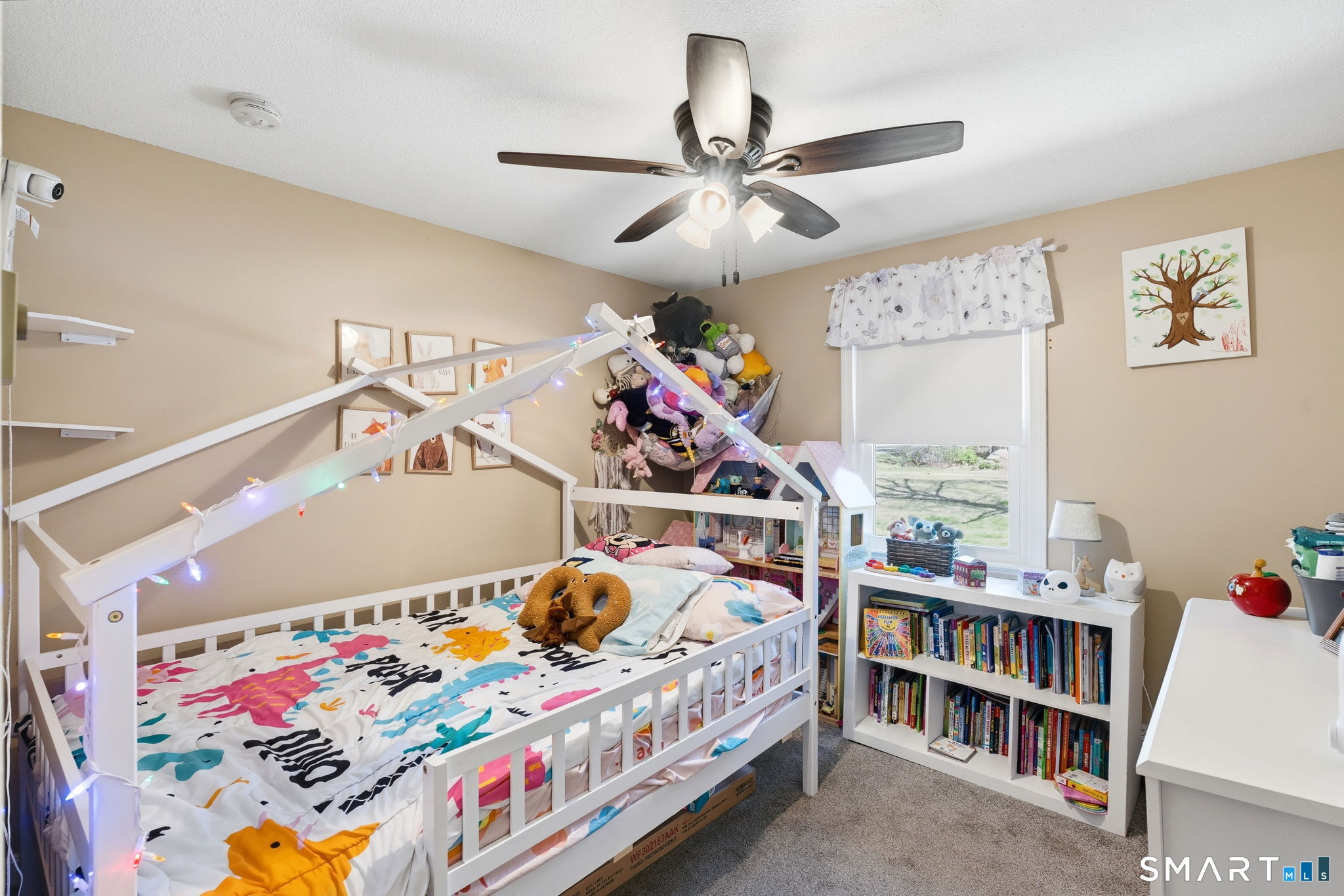 264 Quaddick Town Farm Road Thompson, CT 06277 - Photo 24 of 35 a bedroom with baby bed toys and paintings on the wall