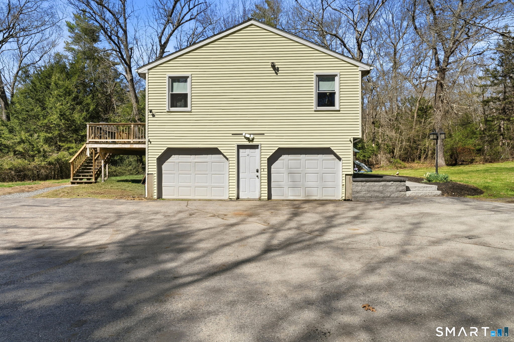 264 Quaddick Town Farm Road Thompson, CT 06277 - Photo 4 of 35 a front view of a house with a yard and garage