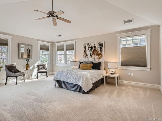 a living room with a bed furniture and a window