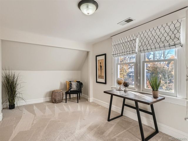 a workspace with furniture and a window