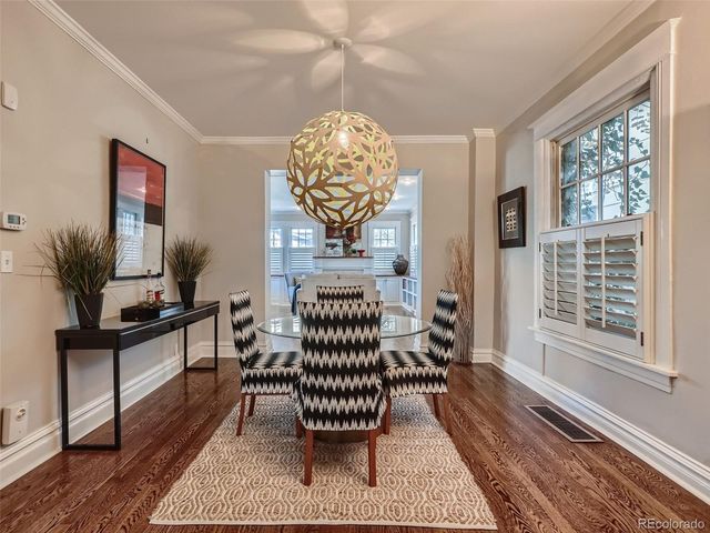 a living room with furniture wooden floor and a rug