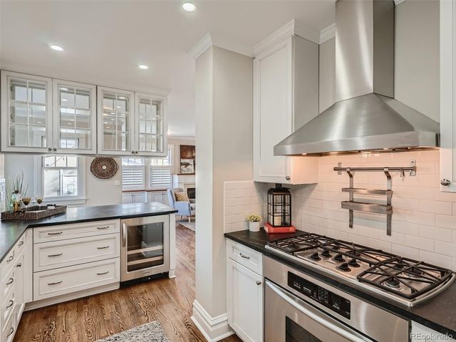 a kitchen with granite countertop a stove and a sink