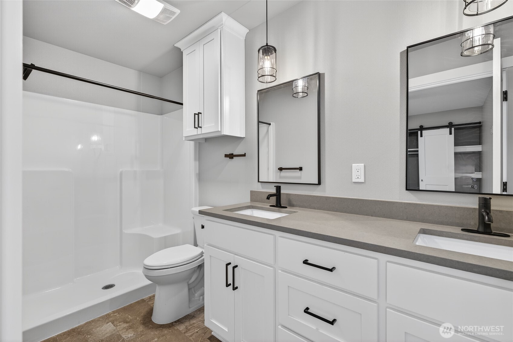 109 7th Street Southwest Long Beach, WA 98631 - Photo 19 of 22 a bathroom with a granite countertop sink a toilet and a mirror