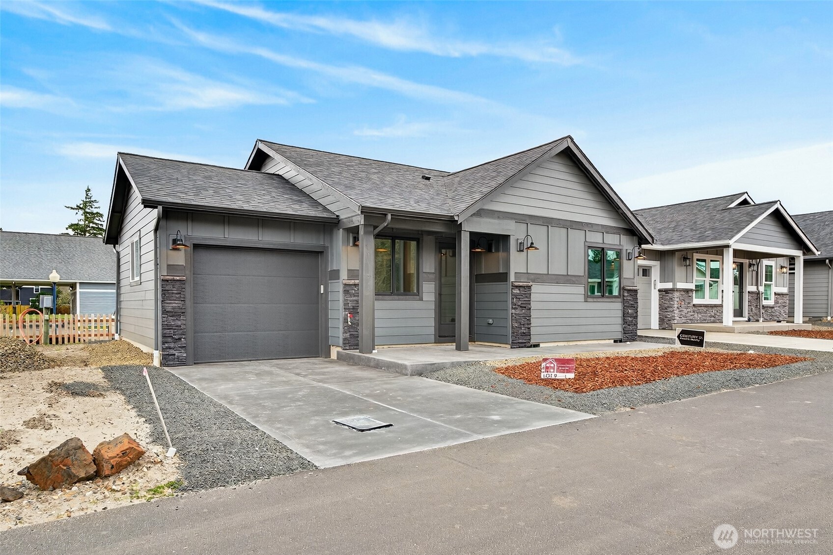 109 7th Street Southwest Long Beach, WA 98631 - Photo 21 of 22 a front view of a house with a garage