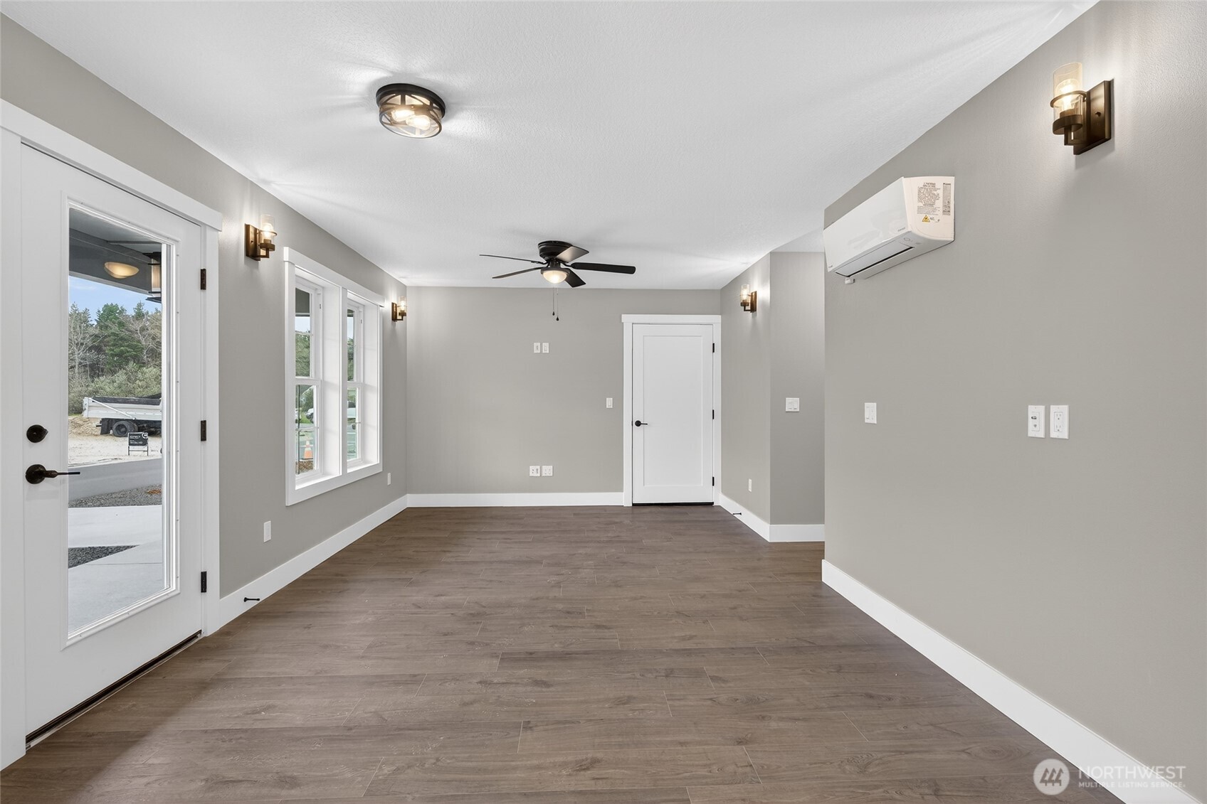 109 7th Street Southwest Long Beach, WA 98631 - Photo 4 of 22 a view of a hallway with wooden floor and cabinet