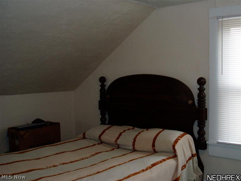 3877 South Ridge Road Perry, OH 44081 - Photo 22 of 25 Roof lines provide architectural interest and a homey feel to the bedrooms.