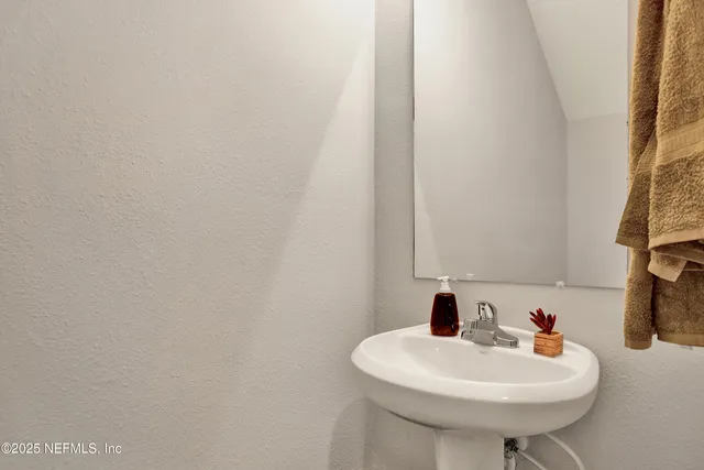 a white sink sitting next to a white sink