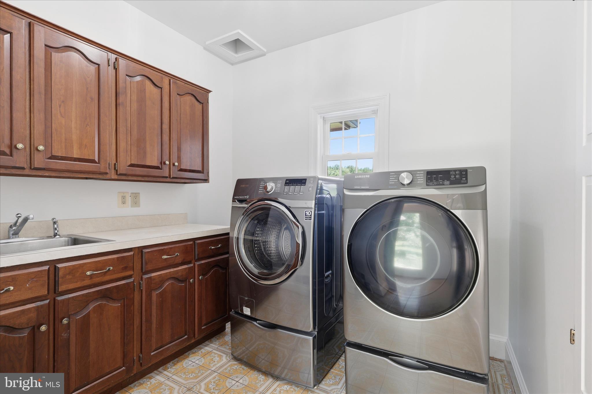 1051 Kelso Road Great Falls, VA 22066 - Photo 15 of 40 Main level laundry room with chute