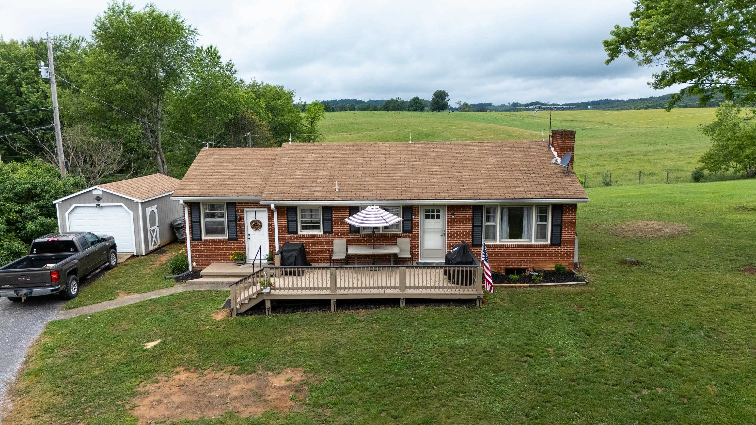 7827 Lee Highway Raphine, VA 24472 - Photo 3 of 62 an aerial view of a house with garden space and sitting area