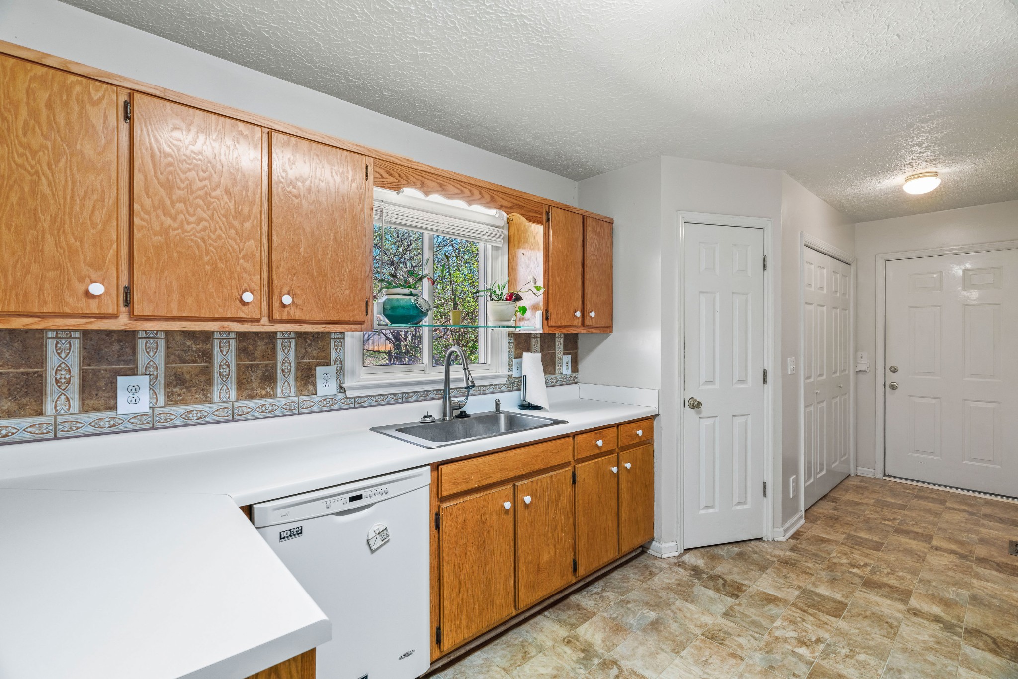 707 Spike Trail Murfreesboro, TN 37129 - Photo 20 of 64 a kitchen with a sink window and cabinets