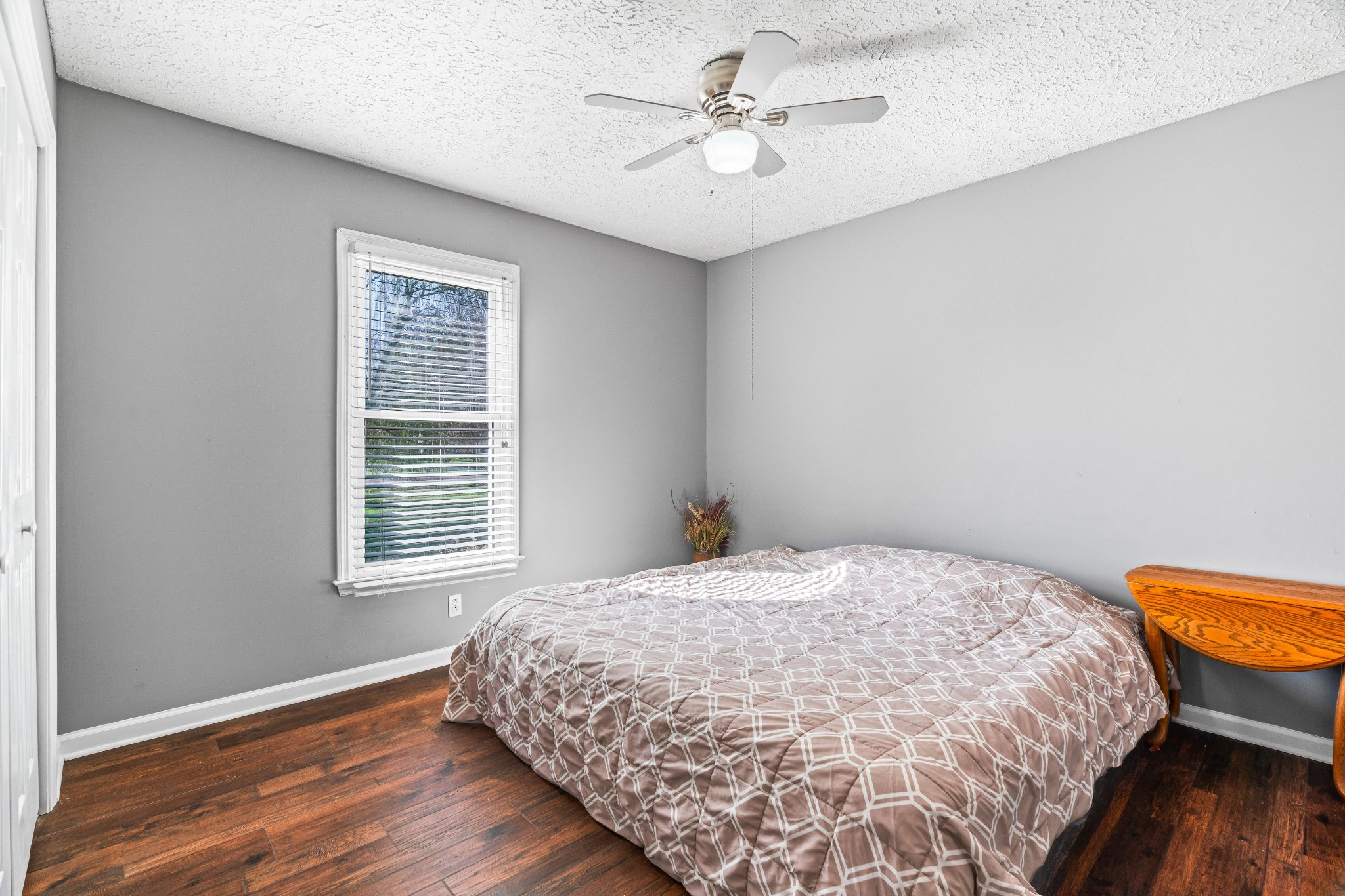 707 Spike Trail Murfreesboro, TN 37129 - Photo 35 of 64 a bedroom with a bed a dresser and wooden floor