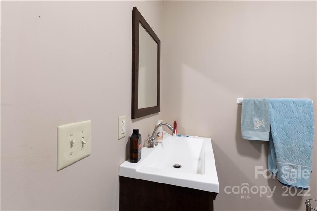 3029 State Highway 55 Clover, SC 29710 - Photo 11 of 34 a bathroom with a sink and a mirror