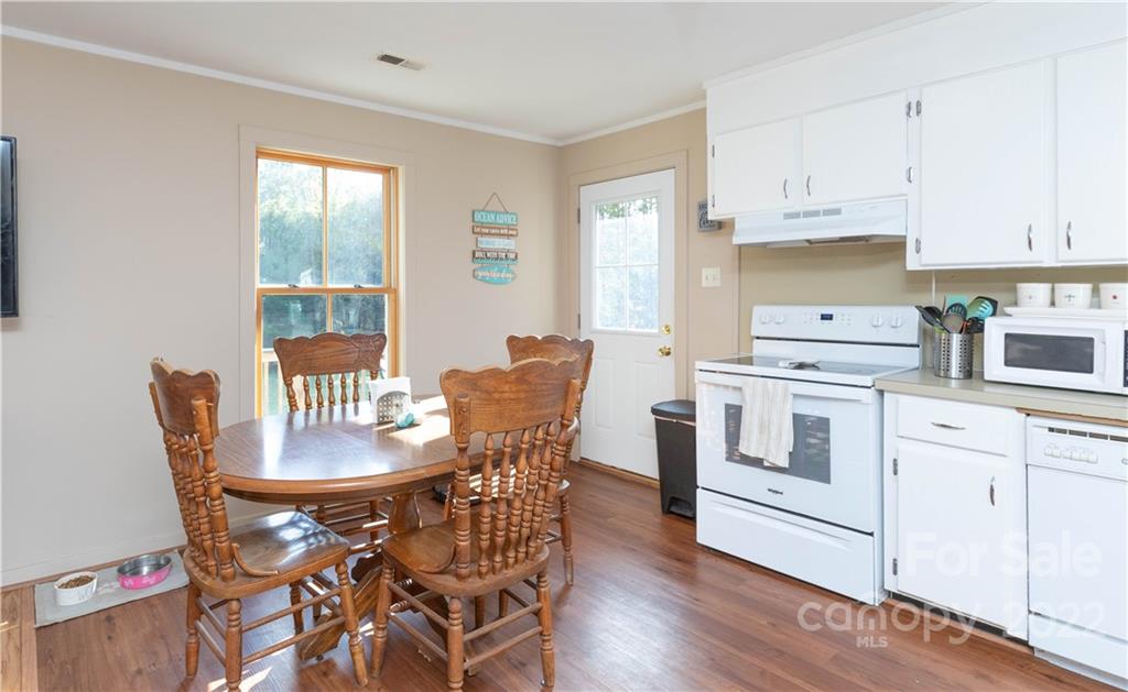 3029 State Highway 55 Clover, SC 29710 - Photo 12 of 34 a view of a dining room with furniture and wooden floor