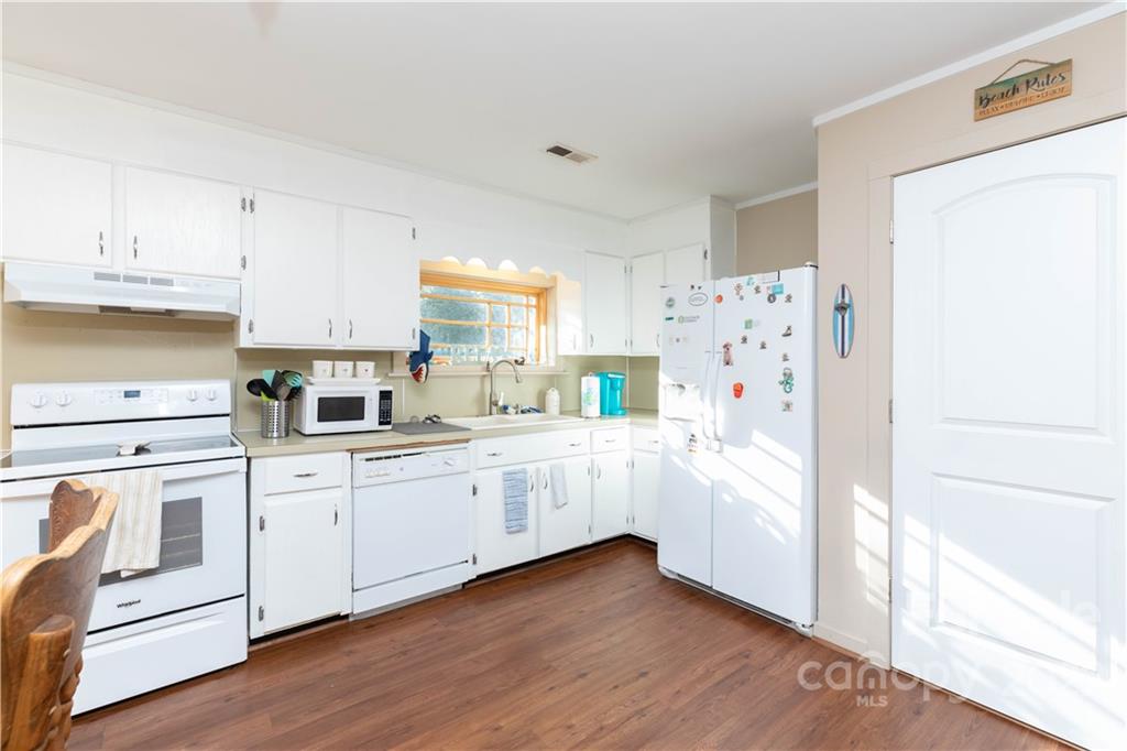 3029 State Highway 55 Clover, SC 29710 - Photo 14 of 34 a kitchen with white cabinets and white appliances