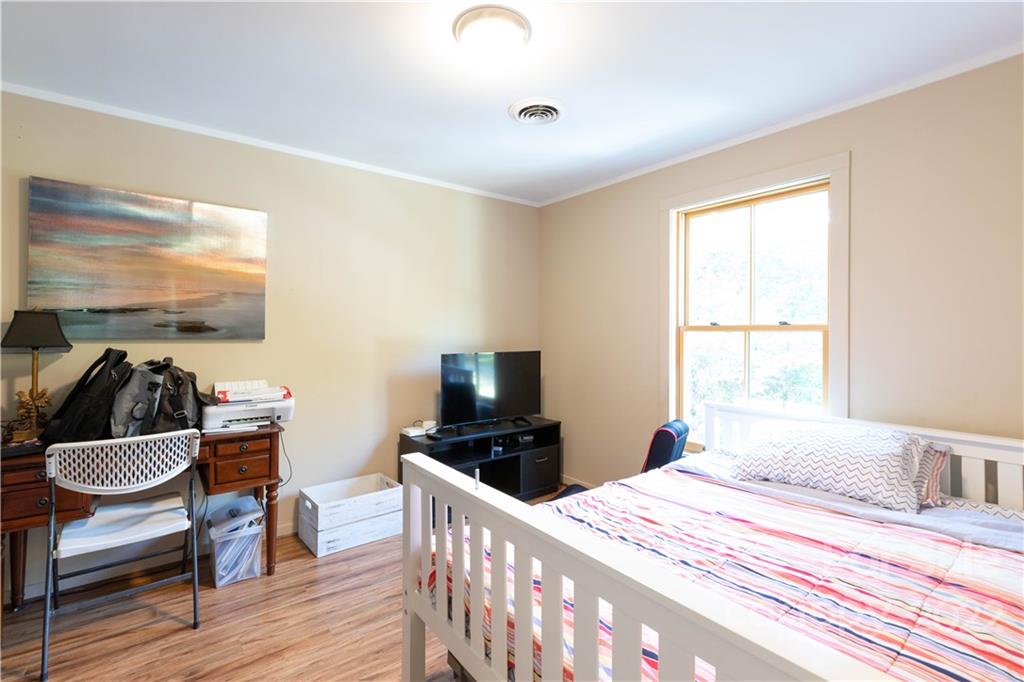 3029 State Highway 55 Clover, SC 29710 - Photo 15 of 34 a bedroom with a bed and wooden floor