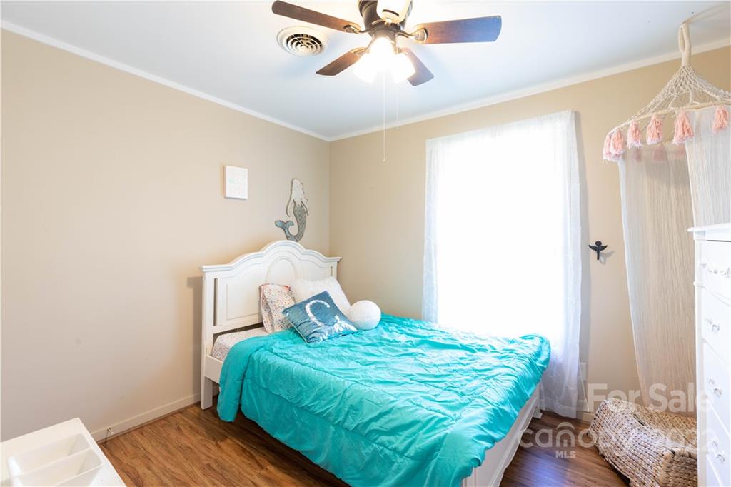 3029 State Highway 55 Clover, SC 29710 - Photo 17 of 34 a bedroom with a bed and wooden floor
