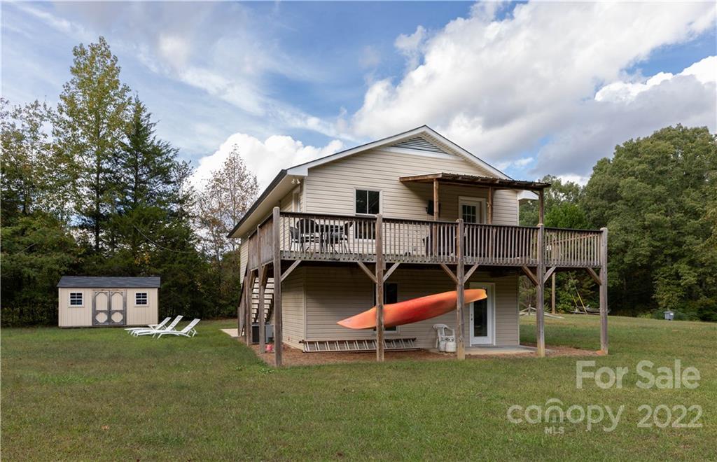 3029 State Highway 55 Clover, SC 29710 - Photo 2 of 34 a backyard of a house with table and chairs