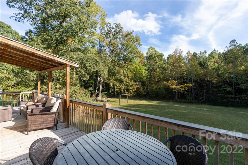 3029 State Highway 55 Clover, SC 29710 - Photo 21 of 34 a view of a wooden deck and a yard
