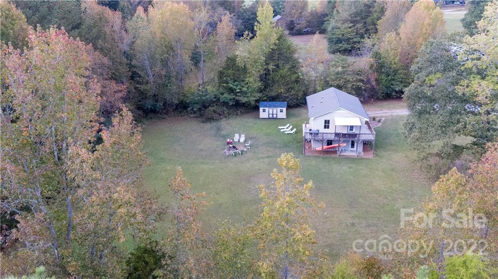 3029 State Highway 55 Clover, SC 29710 - Photo 23 of 34 a view of a wooden house with a yard