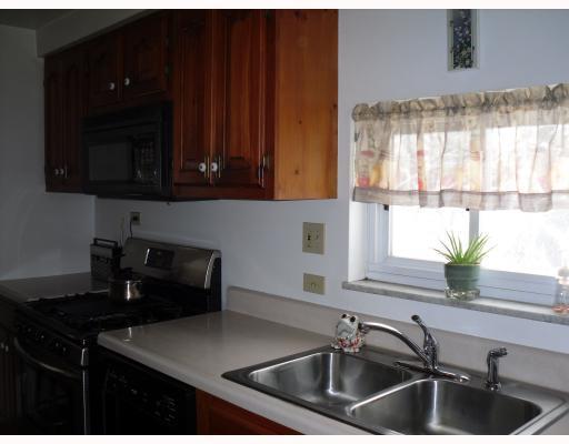 24 Seneca Road Bethel Park, PA 15241 - Photo 7 of 18 Kitchen. CHERRY CABINETRY W/STAINLESS STEEL GAS STOVE, DISHWASHER, DISPOSAL, AND MICROWAVE.