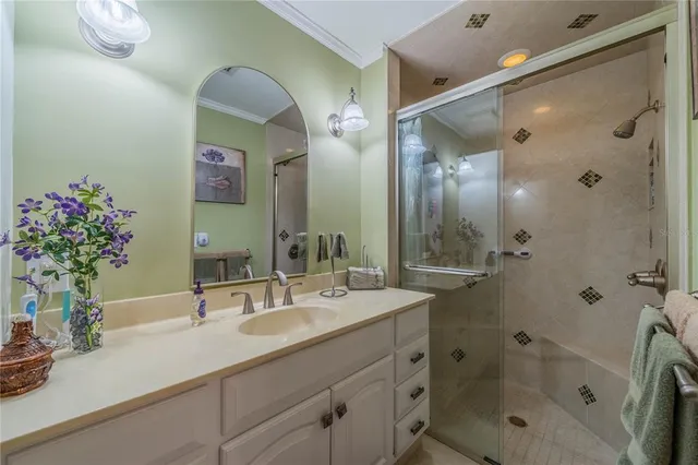 a bathroom with a toilet sink vanity and mirror