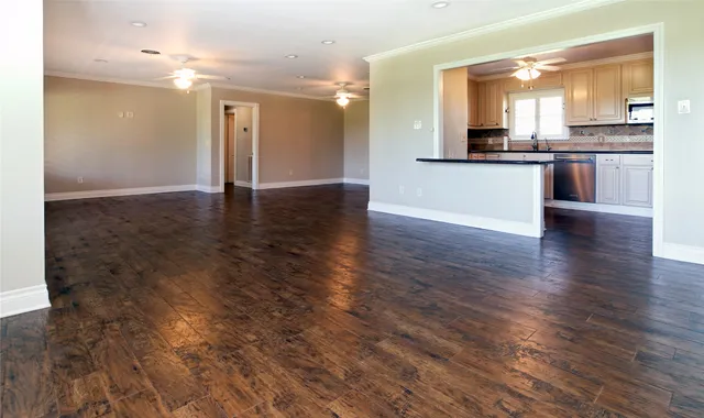 a view of a kitchen with a sink and a refrigerator