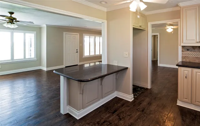 a kitchen with sink and refrigerator