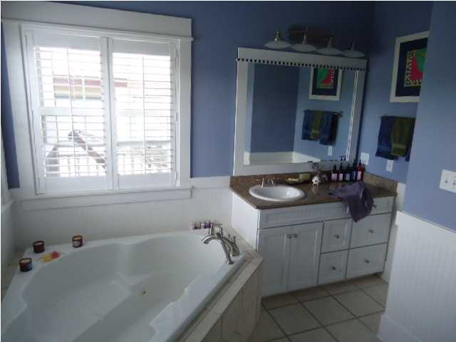 120 Seacrest Beach Blvd Inlet Beach Inlet Beach, FL 32461 - Photo 14 of 31 a bath room with a sink and a mirror