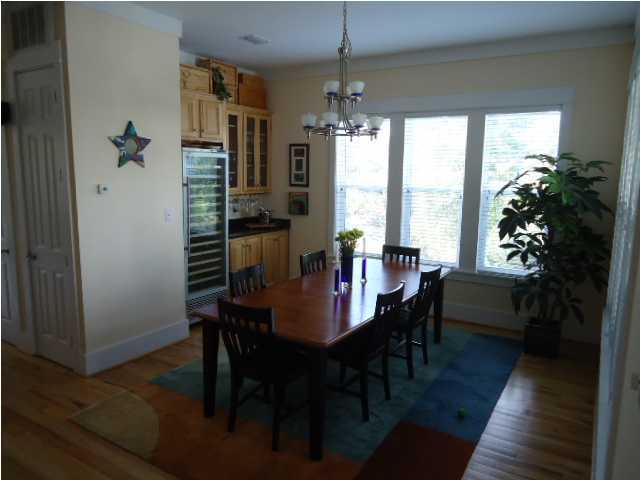 120 Seacrest Beach Blvd Inlet Beach Inlet Beach, FL 32461 - Photo 8 of 31 a view of a dining room with furniture window and wooden floor