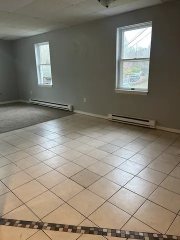 a bathroom with a toilet and a bathtub