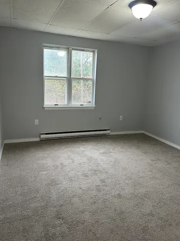 an empty room with closet area