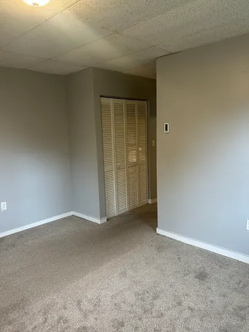 a view of an empty room and closet area