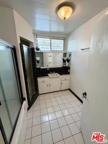 a kitchen with stainless steel appliances a sink and a refrigerator