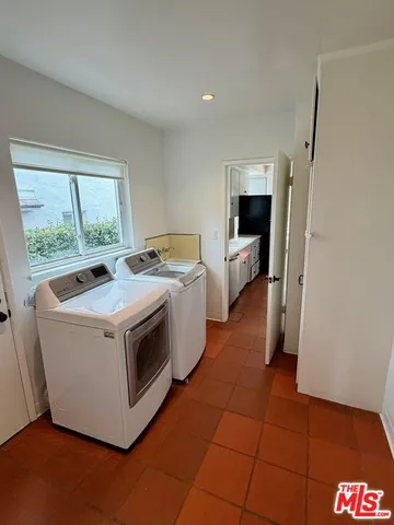 a utility room with washer and dryer