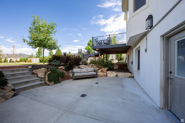 868 Braddock Lane Alpine, UT 84004 - Photo 46 of 64 Expansive concrete patio area with integrated steps and a landscaped rock garden