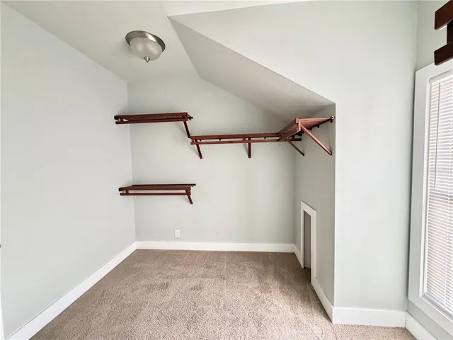 a view of a room with racks on the wall